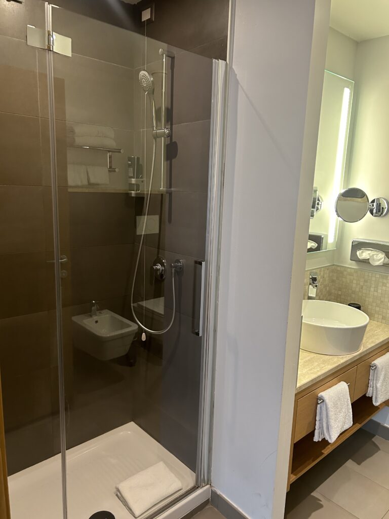 NYX Hotel Milan Review (2026): Is This the Best Hotel Near Milano Centrale? Shower area at NYX Hotel Milan