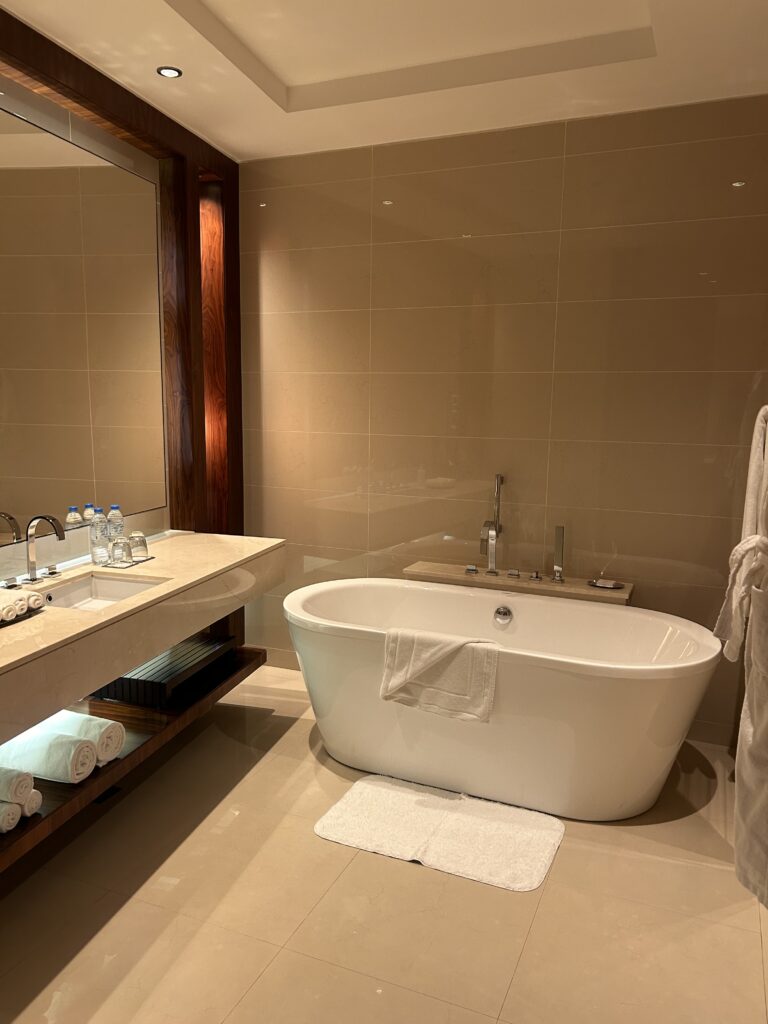 JW Marriott Marquis Dubai Review: The Hotel Emirates Gives for FREE! Luxurious separate bathtub and vanity at JW Marriott Marquis Dubai