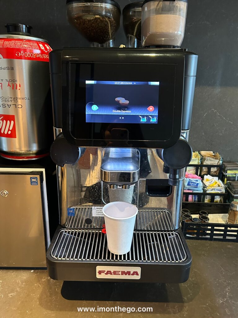 New York Marriott Downtown Review: The Good, The Bad, & The Reality coffee maachine at new york marriott downtown hotel lounge.