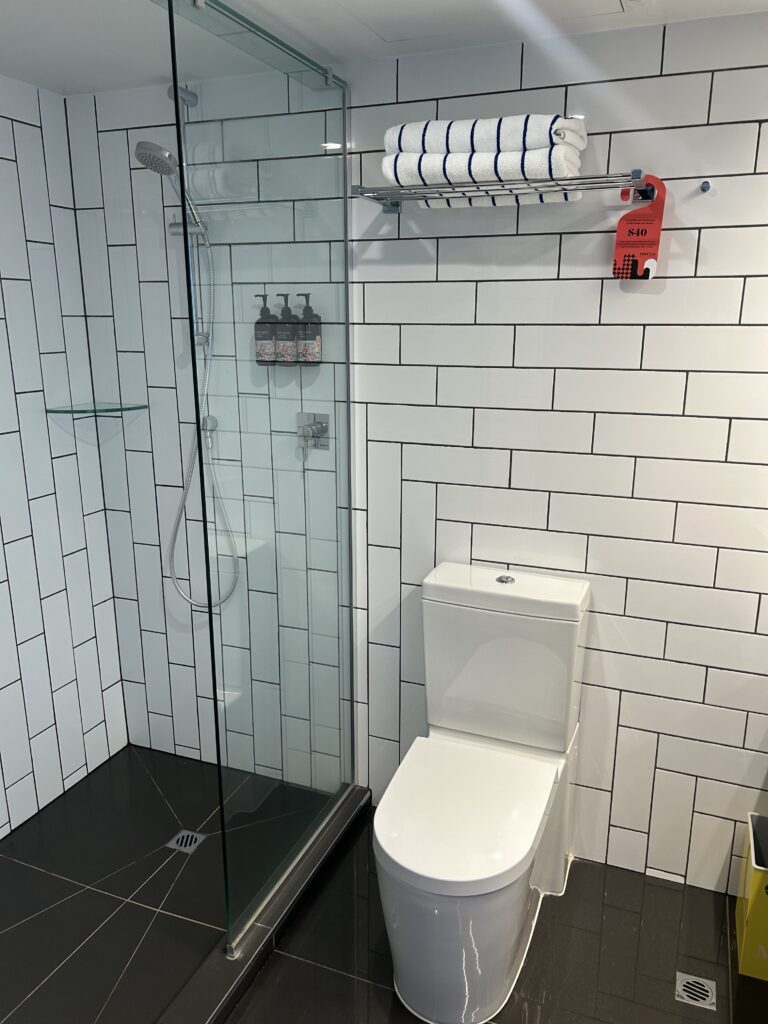 Clean bathroom with full amenity kit at M Social Auckland