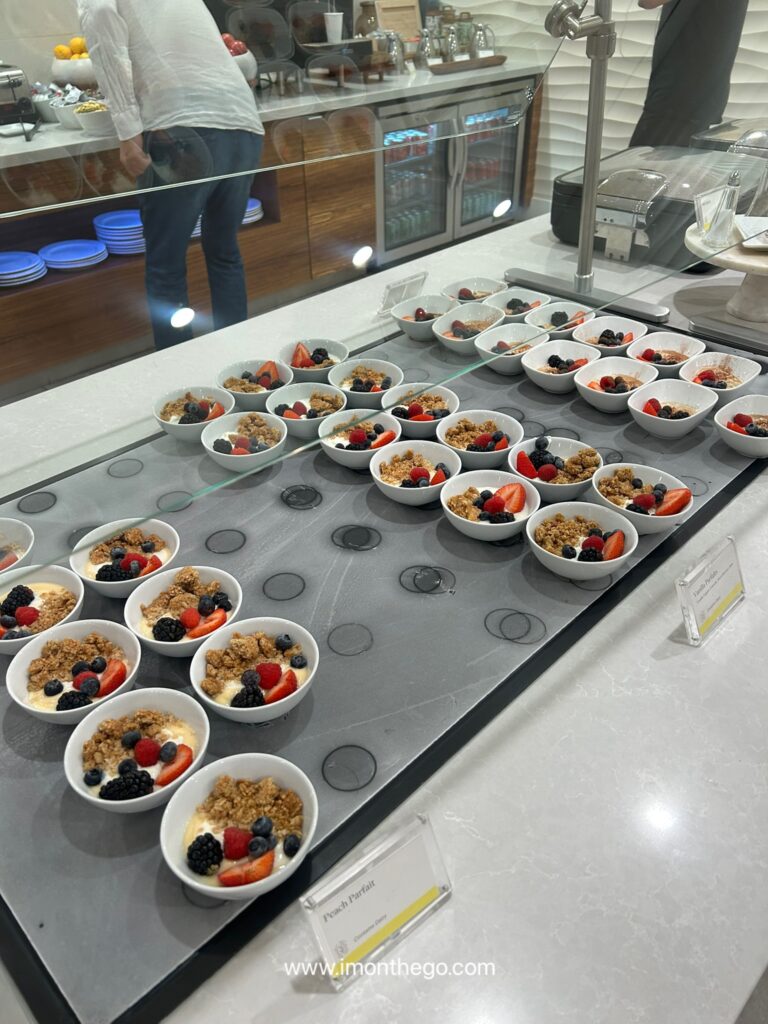 Honest Review of The Westin Los Angeles Airport: Rooms, Breakfast & Free Shuttle Assorted fruits, cheeses, and Chobani yogurt cups at hotel lounge