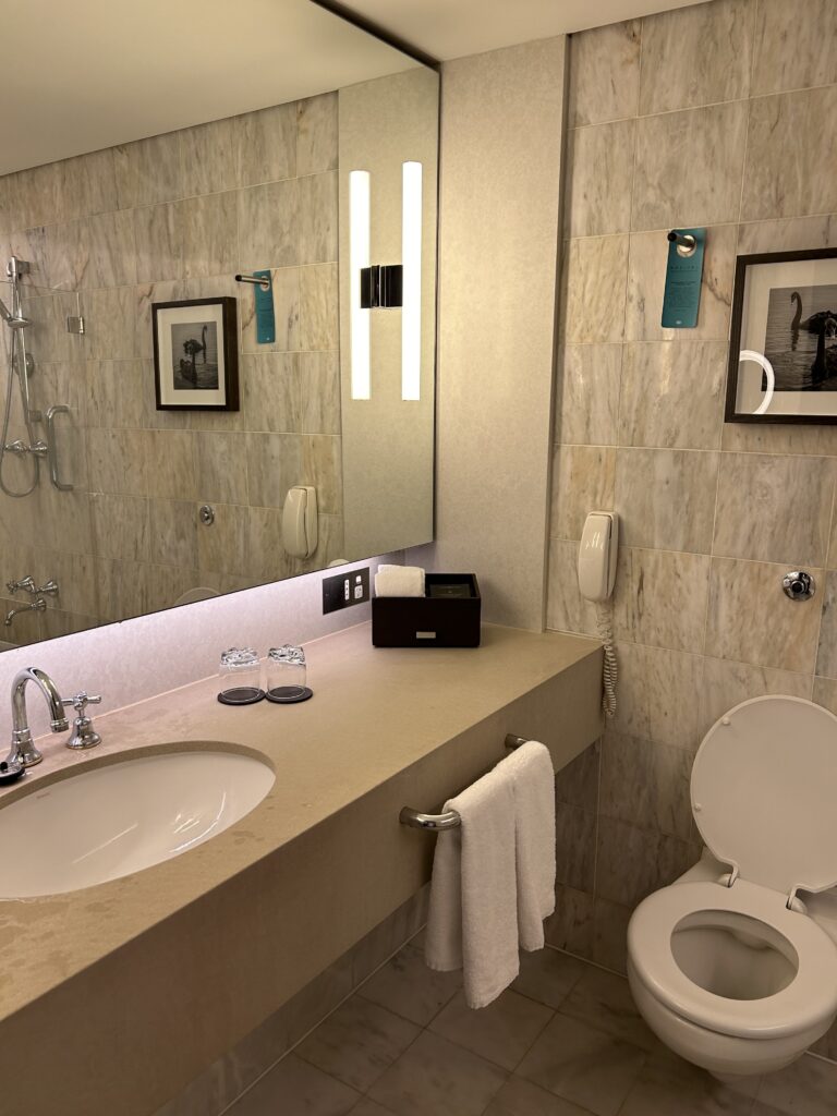 Sofitel Melbourne on Collins: The Ultimate Luxury Stay in Melbourne CBD Clean marble bathroom with deep soaking bathtub at Sofitel Melbourne 2